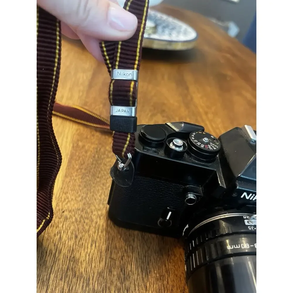 Nikon Black Camera with Brown Strap
